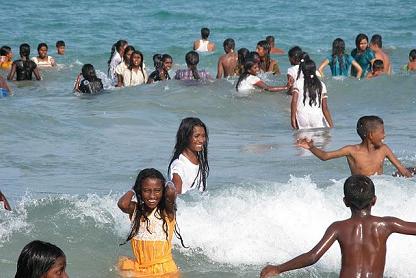 children playing in the sea