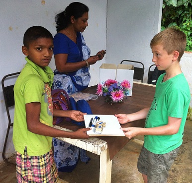Joe handing out writing materials